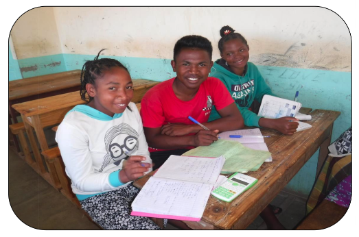 Three students studying together at a desk
